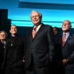 Warren Buffett, the 'Oracle of Omaha,' in a thoughtful pose, symbolizing his enduring influence.