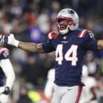 Los Angeles Chargers and New England Patriots players competing in an NFL playoff game