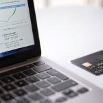 A visual representation of a malicious script stealing credit card details from an online checkout page, symbolizing a web skimming attack.