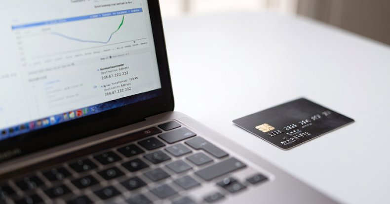 A visual representation of a malicious script stealing credit card details from an online checkout page, symbolizing a web skimming attack.