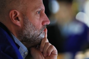 Beneath the Surface: The Stagnant White-Collar Job Market Despite Fewer Layoff Headlines 3 A person looking at job listings on a laptop, symbolizing the challenging white-collar job market.