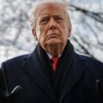 President Donald Trump speaks to reporters on the South Lawn before boarding Marine One.