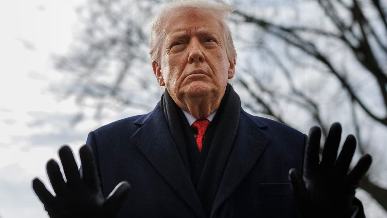 President Donald Trump speaks to reporters on the South Lawn before boarding Marine One.