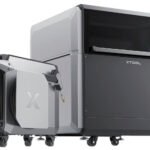 The xTool MetalFab laser system cutting a Makey robot stencil from 1.5mm thick steel, producing a shower of sparks.