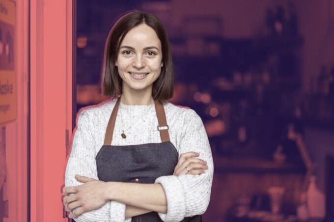 A diverse group of young entrepreneurs collaborating in a modern office setting, representing the new generation of franchise owners.