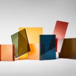 A vibrant display of 3form's 2026 Color Collection panels, showcasing the eight historically inspired hues like Cabernet, Spice, and Indigo in a modern interior setting.