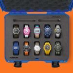 A diverse collection of affordable watches displayed in a protective case, showcasing various styles and brands.