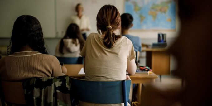 The AI Divide: How Unequal Access in K-12 Education Threatens Our Future 7 Students from diverse backgrounds using AI tools in a classroom setting, symbolizing both the potential and the current disparity in access.