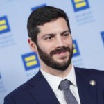 AI Titans Clash: A Political Battle for the Future of Tech in New York 6 New York Assembly member Alex Bores amidst a political campaign, symbolizing the clash of AI super PACs.