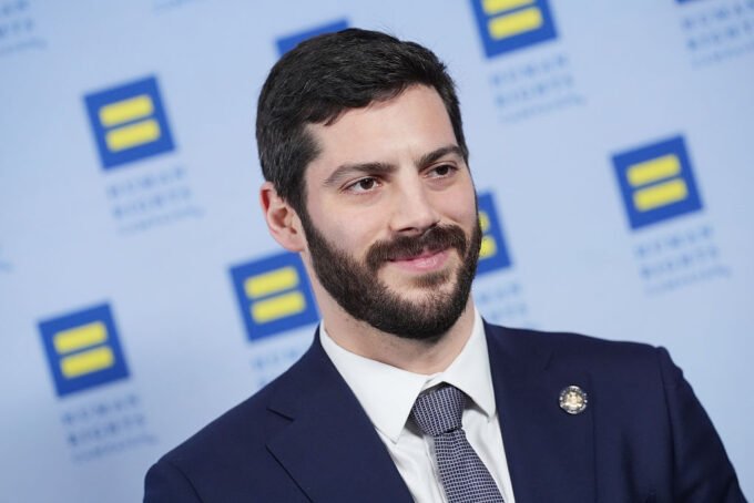 AI Titans Clash: A Political Battle for the Future of Tech in New York 9 New York Assembly member Alex Bores amidst a political campaign, symbolizing the clash of AI super PACs.