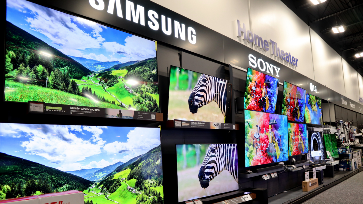 A smart TV screen displaying AI-related graphics with memory chips in the background, symbolizing the impact of AI on TV prices.