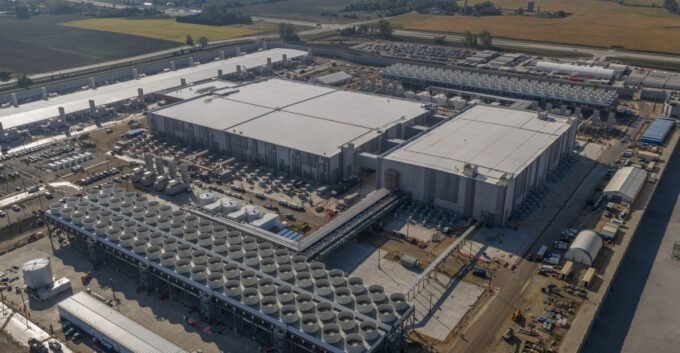 A futuristic image depicting AI data centers, symbolizing the intersection of technology and infrastructure, with a subtle nod to environmental impact.