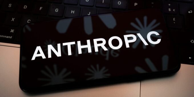 An abstract depiction of AI technology with a warning sign, representing the peril mentioned by an Anthropic safety lead.