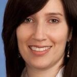 A Goldman Sachs executive discussing future job skills in an AI-powered office environment.