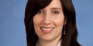 Navigating the AI Era: Goldman Sachs Partner Reveals Essential Skills for Tomorrow's Workforce 6 A Goldman Sachs executive discussing future job skills in an AI-powered office environment.