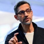 Google CEO Sundar Pichai gestures during Google's annual I/O developers conference, symbolizing Alphabet's focus on AI.