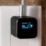 Anker 45W Nano charger with a display screen showing charging information and animated character