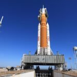 NASA's Space Launch System (SLS) rocket and Orion spacecraft on the launchpad at Kennedy Space Center, awaiting rollback to the Vehicle Assembly Building.