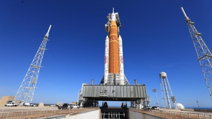 NASA's Space Launch System (SLS) rocket and Orion spacecraft on the launchpad at Kennedy Space Center, awaiting rollback to the Vehicle Assembly Building.