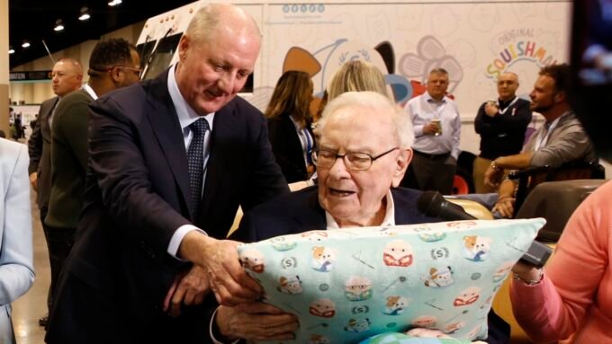 Buffett's Final Quarter: Berkshire Hathaway's Operating Earnings Dip Amid Leadership Transition 5 Warren Buffett and Greg Abel walking through the Berkshire Hathaway Annual Shareholders Meeting in Omaha, Nebraska