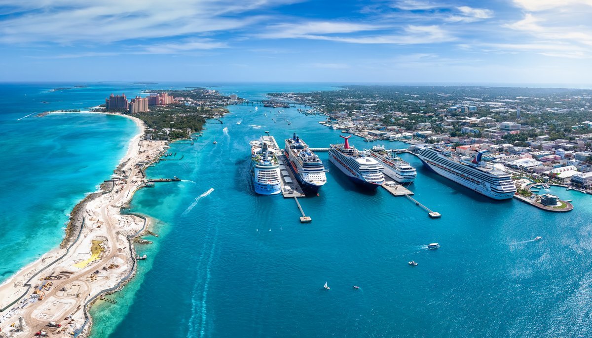 Unveiling Paradise: U.S. News Ranks the Best Caribbean Cruise Lines 3 A luxurious cruise ship sailing through the vibrant blue waters of the Caribbean at sunset.