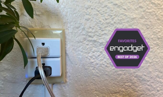 A selection of smart plugs, including the Kasa Smart Plug Mini EP25 and Amazon Smart Plug, arranged on a modern surface.