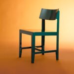 The Bishop Chair: Konstantin Grcic's Masterclass in Form and Absence 4 The Bishop Chair by Konstantin Grcic for Magis, showcasing its glossy finish and bent steel form.