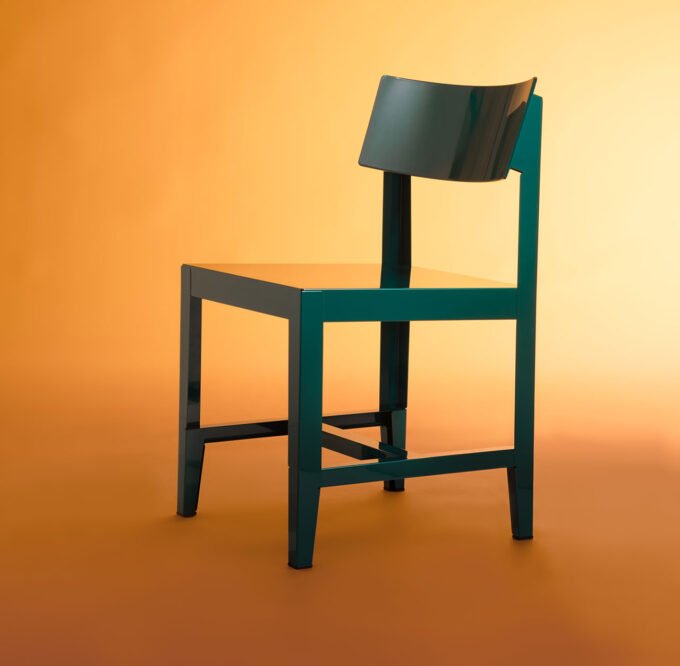 The Bishop Chair: Konstantin Grcic's Masterclass in Form and Absence 7 The Bishop Chair by Konstantin Grcic for Magis, showcasing its glossy finish and bent steel form.