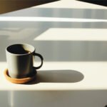 A steaming cup of black coffee, symbolizing health and vitality