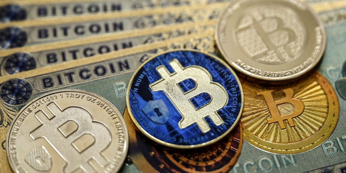 A digital illustration showing cryptocurrency symbols (Bitcoin, Ethereum) in a downward trend, with a padlock icon representing suspended withdrawals.