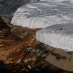 Close-up of the crimson 'Blood Falls' flowing down the white Taylor Glacier in Antarctica.