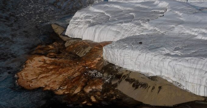 Close-up of the crimson 'Blood Falls' flowing down the white Taylor Glacier in Antarctica.