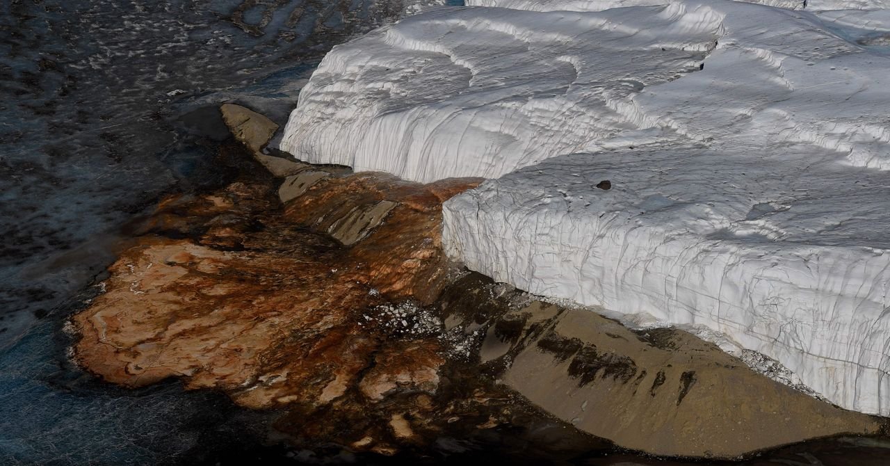Close-up of the crimson 'Blood Falls' flowing down the white Taylor Glacier in Antarctica.