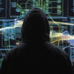 Illustration of cyber warfare, showing digital threats targeting a map of Ukraine, with malware code and a shield icon.