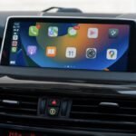 Apple CarPlay Revolutionized: ChatGPT, Claude, and Gemini Set to Integrate with iOS 26.4 4 Apple CarPlay interface showing AI assistant integration with ChatGPT, Claude, or Gemini icons.