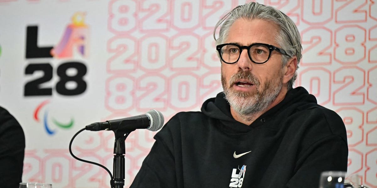 Wasserman's Shock Sale: Epstein Files Fallout Forces Talent Mogul's Hand 3 Casey Wasserman speaking at an event, with the Wasserman Media Group logo in the background.