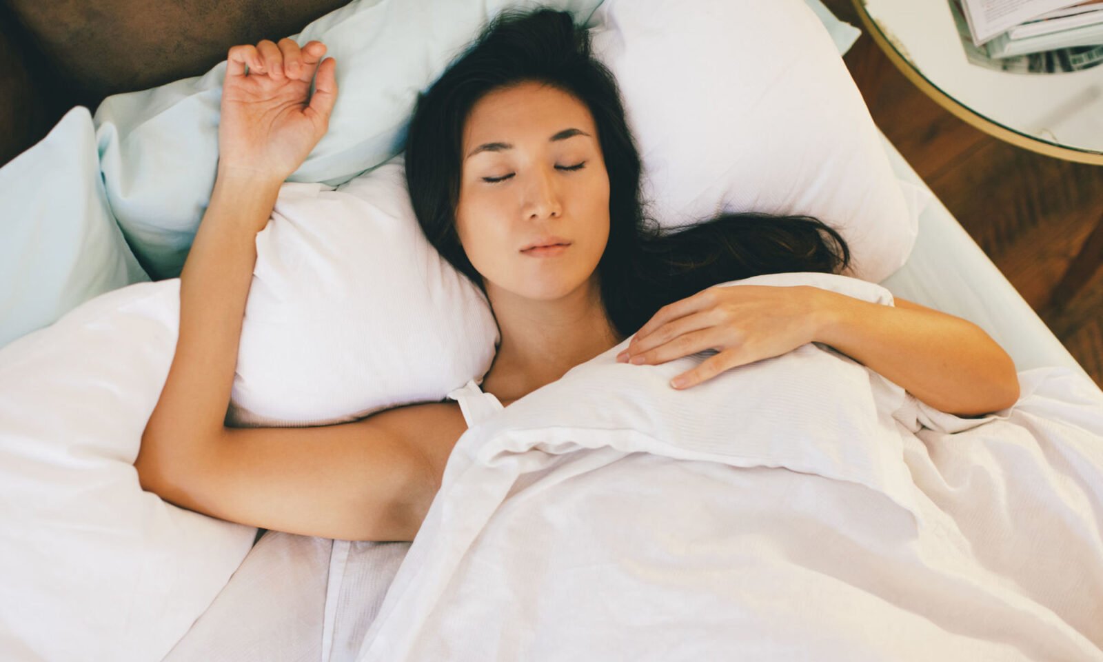 Good News for the Sleep-Deprived: Experts Confirm You Can Actually Catch Up on Zzz's 3 Person sleeping peacefully, illustrating the concept of catching up on rest.