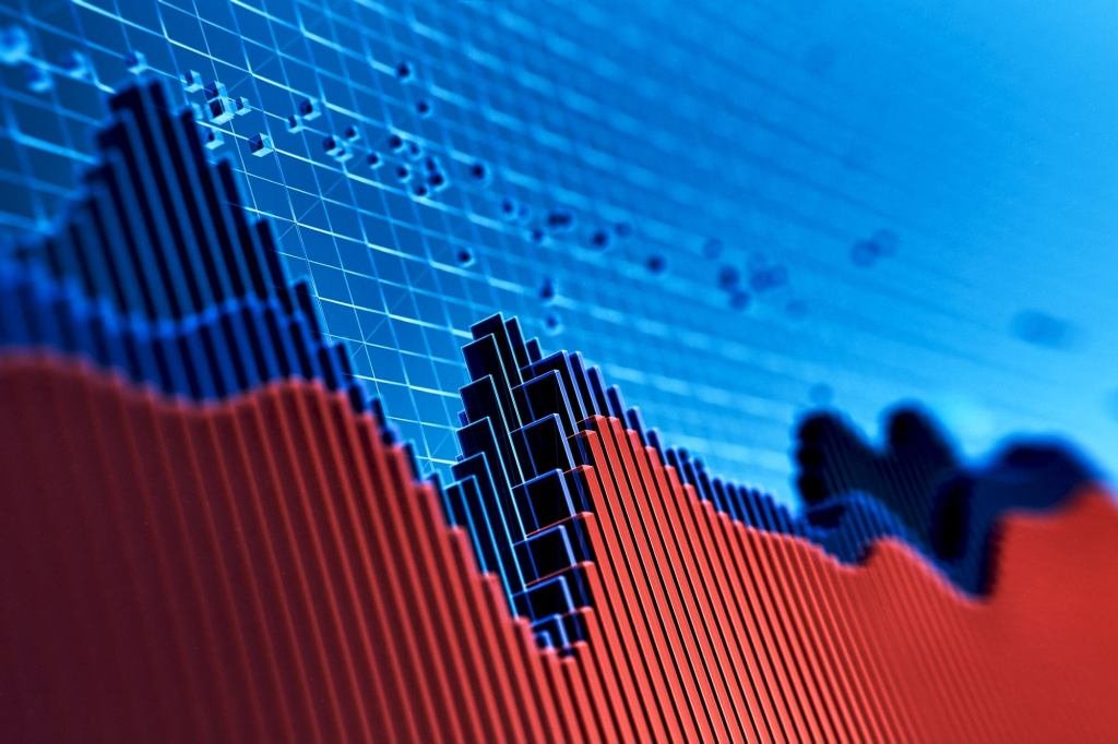 Seven prominent CEOs discussing economic trends and data in a boardroom setting