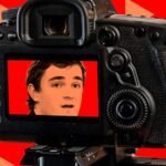 Image depicting a right-wing provocateur, Nick Shirley, with a tripod-mounted phone, outside a childcare facility, symbolizing his controversial investigations.