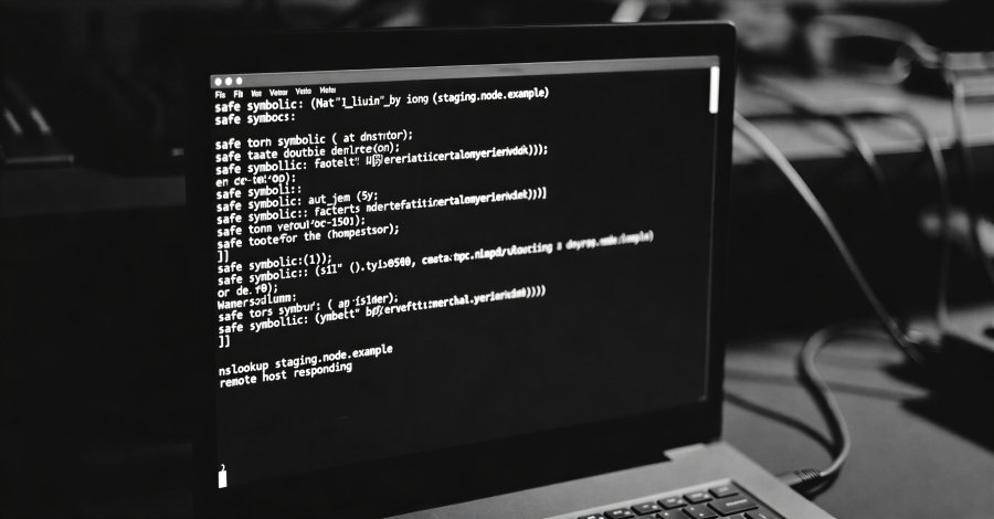 Illustration of a DNS-based attack, showing a computer initiating an nslookup command to a malicious DNS server to retrieve a malware payload.
