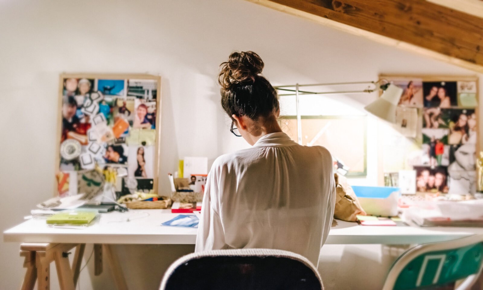 Hand operating a computer mouse on a desk, illustrating the common contact point for germs.