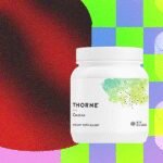 The Creatine Craze: Demystifying the Supplement Sweeping the Wellness World 6 A scoop of white creatine powder in a container, symbolizing fitness and wellness supplementation.
