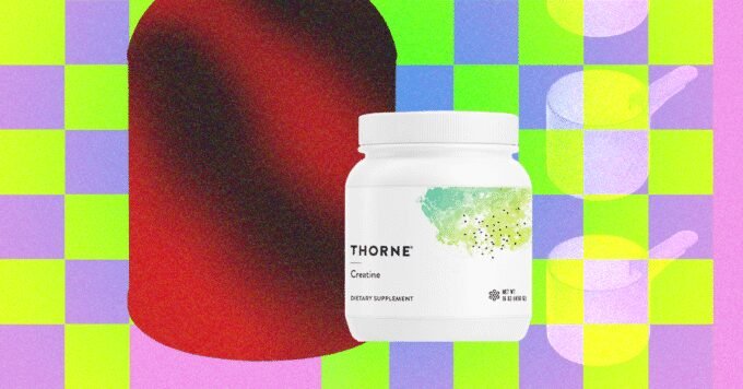 A scoop of white creatine powder in a container, symbolizing fitness and wellness supplementation.