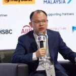 Stablecoins: The Digital Catalyst for Cross-Border Payments, Argues XTransfer CEO Bill Deng 6 Bill Deng, CEO of XTransfer, discussing the future of stablecoins in cross-border payments amidst a backdrop of global trade.