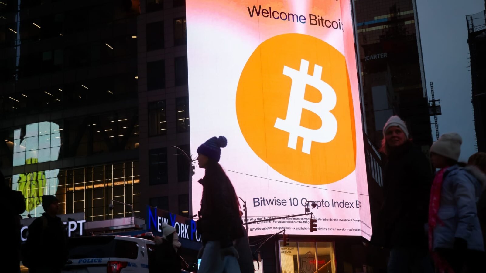 Bitcoin signage displayed prominently in Times Square, New York, amidst market volatility.