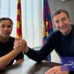 صورة لأجاى تافاريس بقميص برشلونة أو نورويتش سيتي