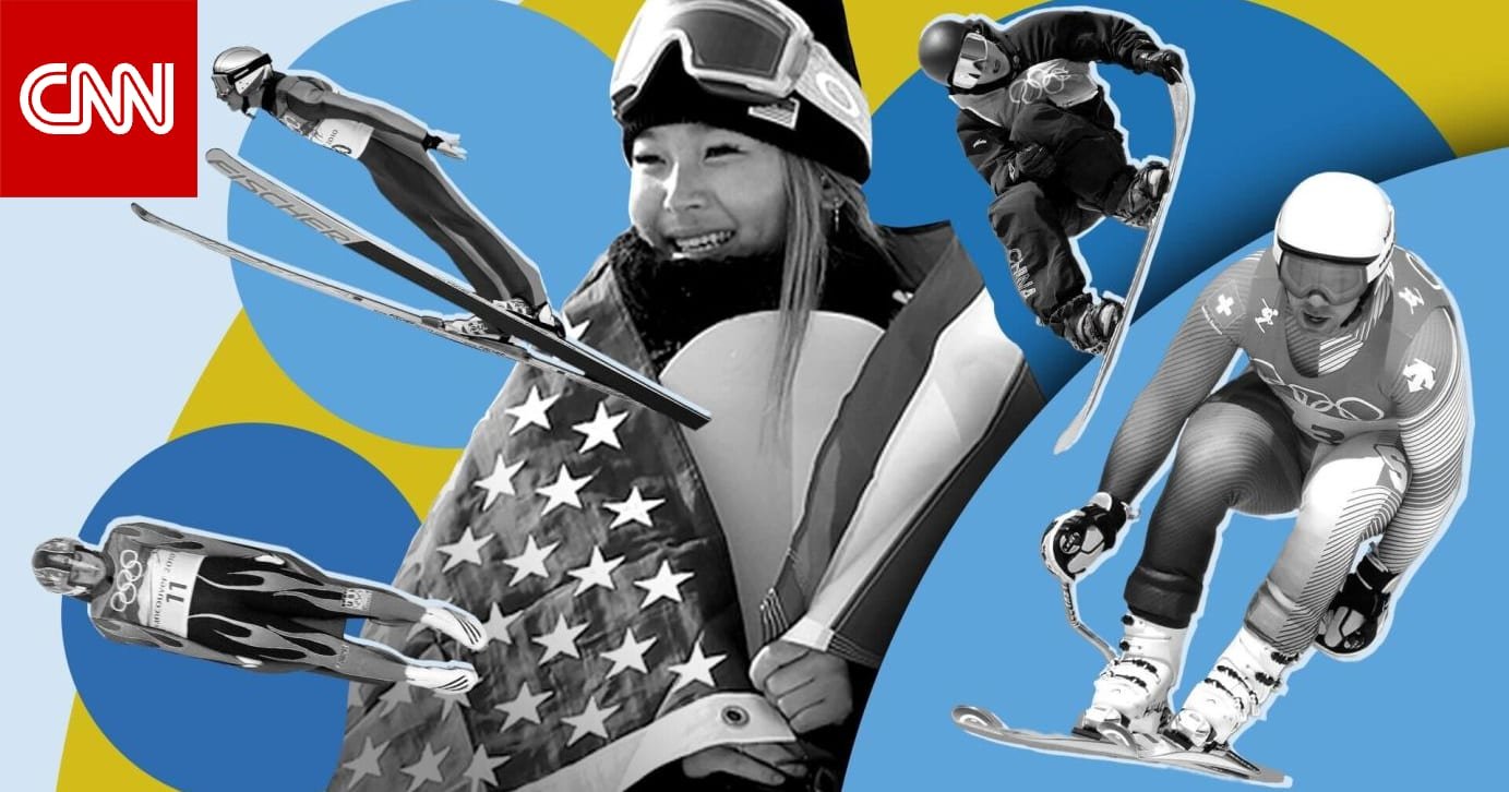 صورة بانورامية لمسار تزلج أولمبي مغطى بالثلوج مع متزلج يقفز في الهواء، تظهر الأجواء الباردة والرياح الشديدة.