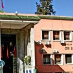 صورة لمبنى محكمة الاستئناف بمراكش أو لسيارة شرطة قضائية.