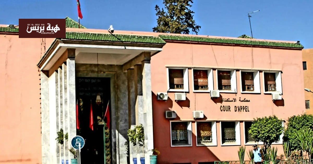 صورة لمبنى محكمة الاستئناف بمراكش أو لسيارة شرطة قضائية.