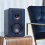 DALI KUPID Hi-Fi speakers in a modern home setting, showcasing their compact size and stylish design.